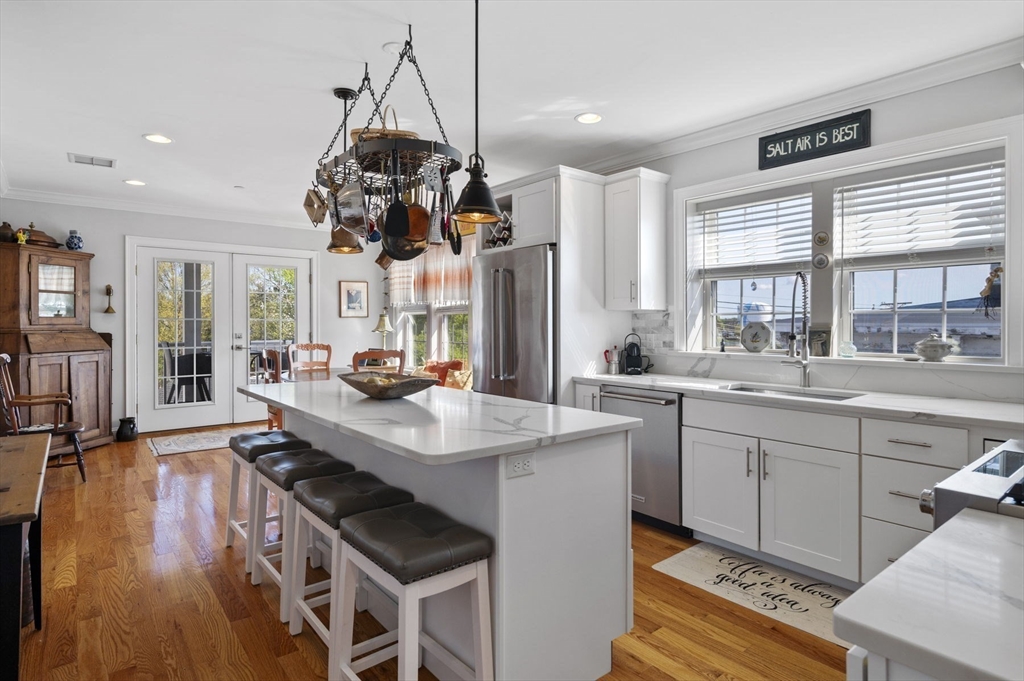 13 Spring Street, Unit 3 Salem, MA 01970 - Photo 14 of 37 a kitchen with stainless steel appliances granite countertop a sink a stove and a refrigerator