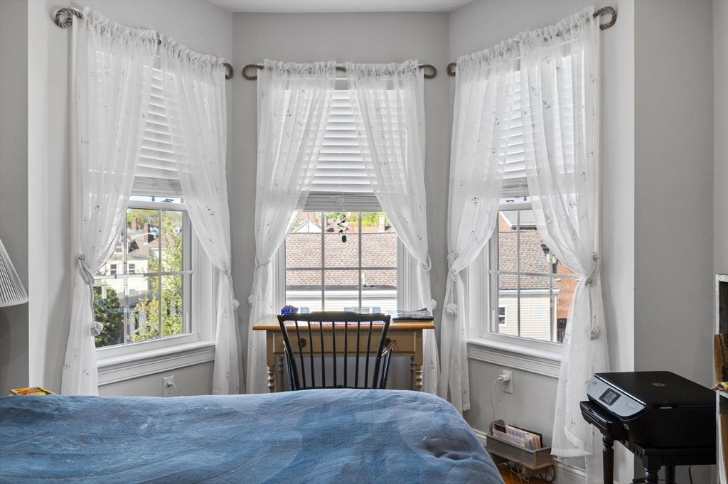 13 Spring Street, Unit 3 Salem, MA 01970 - Photo 22 of 37 a view of a bedroom with furniture and a window