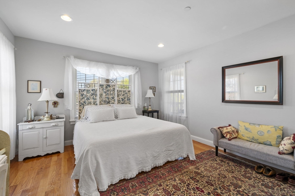 13 Spring Street, Unit 3 Salem, MA 01970 - Photo 23 of 37 a bedroom with a large bed and a window