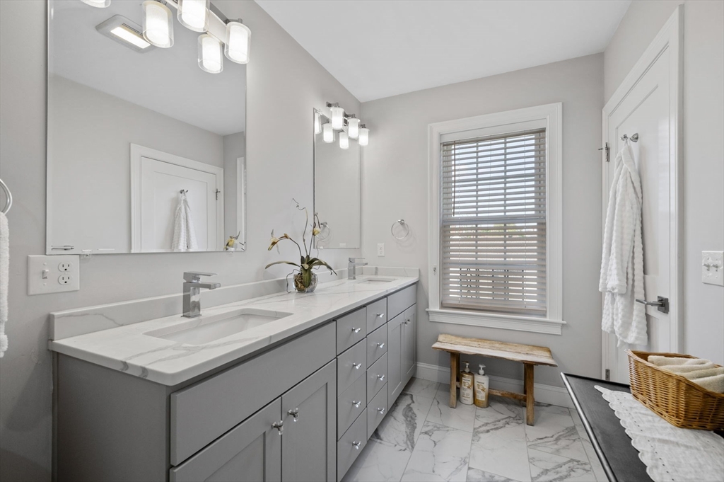 13 Spring Street, Unit 3 Salem, MA 01970 - Photo 26 of 37 a bathroom with a sink double vanity and a mirror