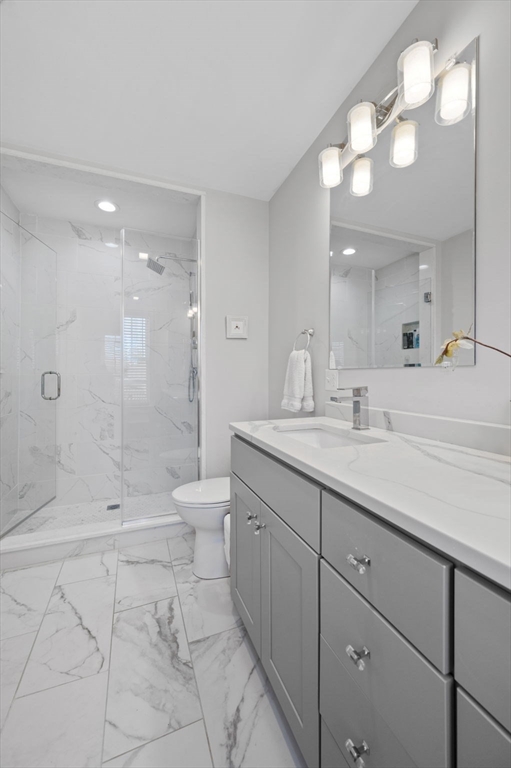 13 Spring Street, Unit 3 Salem, MA 01970 - Photo 28 of 37 a bathroom with a shower a sink and a mirror