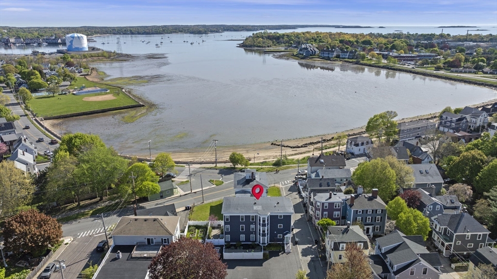 13 Spring Street, Unit 3 Salem, MA 01970 - Photo 36 of 37 an aerial view of a house with swimming pool and lake view