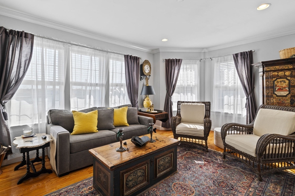 13 Spring Street, Unit 3 Salem, MA 01970 - Photo 7 of 37 a living room with furniture and a large window