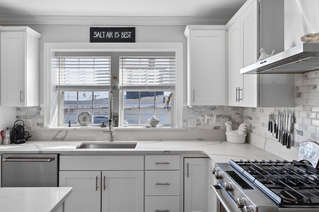 13 Spring Street, Unit 3 Salem, MA 01970 - Photo 10 of 37 a kitchen with stainless steel appliances a sink stove and window