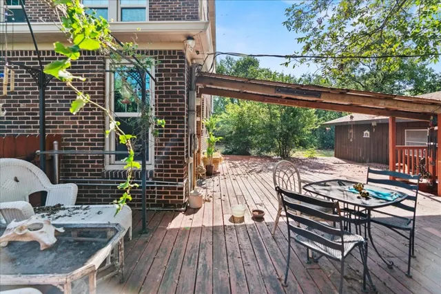 a view of balcony with wooden floor