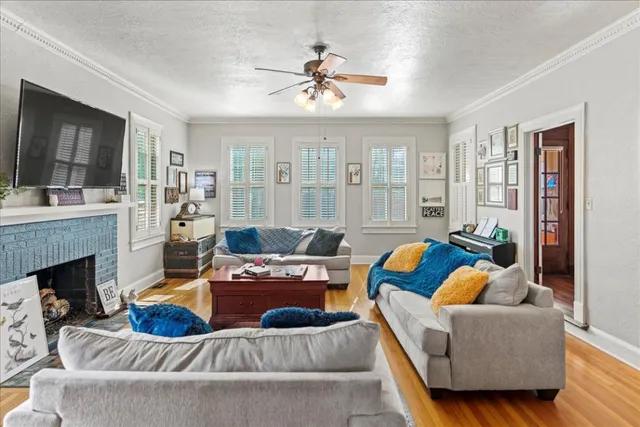 a living room with furniture and a fireplace
