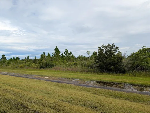 a view of a lake with a big yard