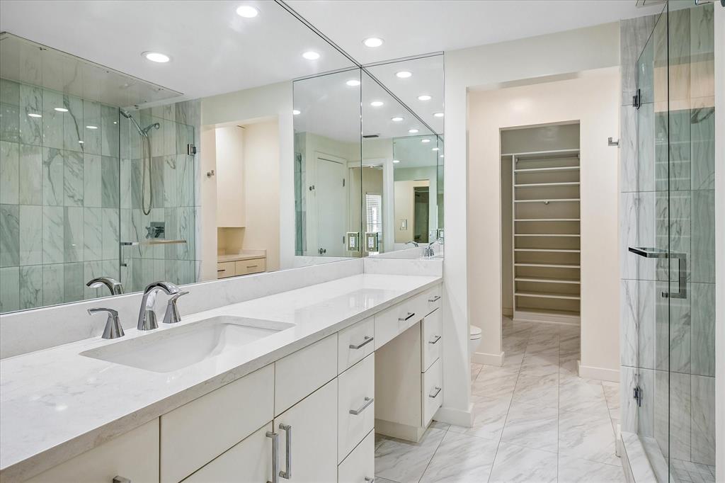 12680 Hillcrest Road, Unit 1109 Dallas, TX 75230 - Photo 13 of 22 Updated ensuite primary bathroom with a vanity area.