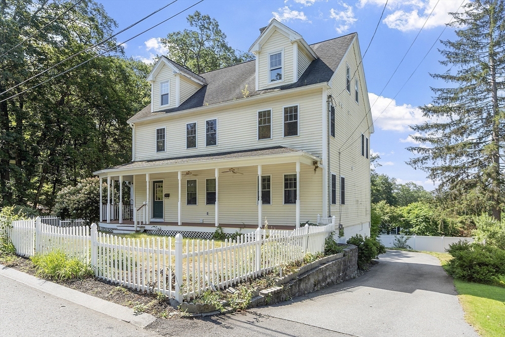 front view of a house with a small yard