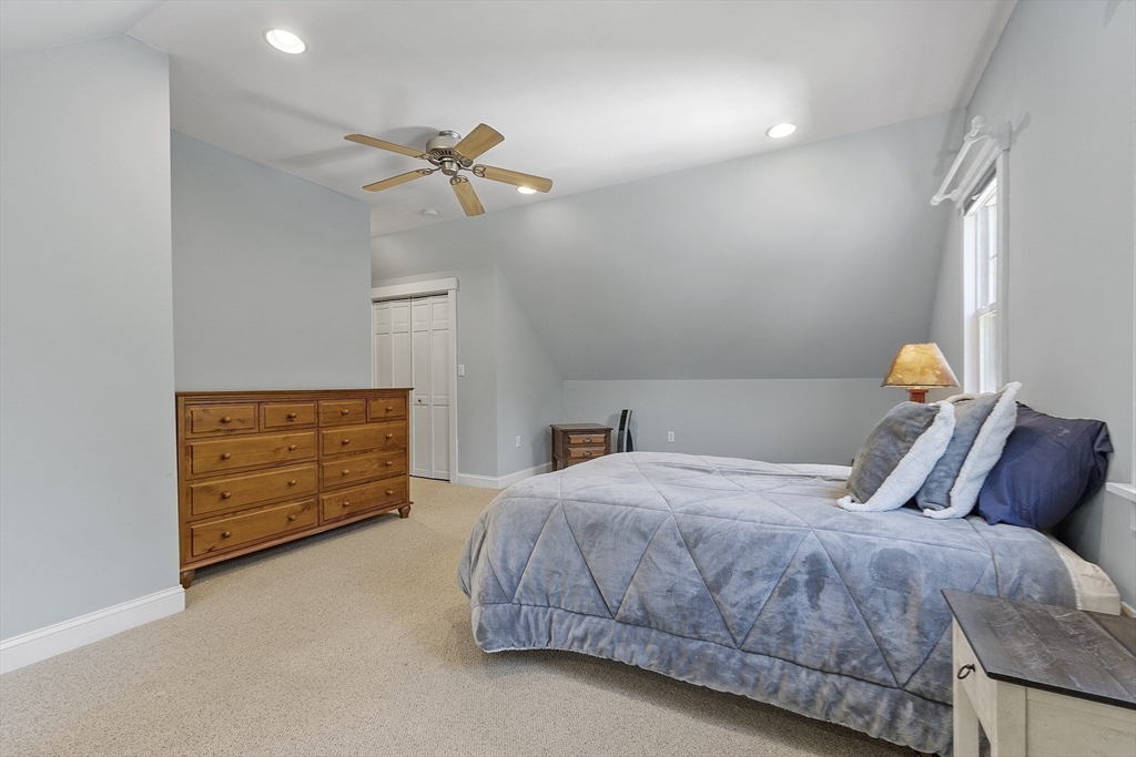 21 High Street Ayer, MA 01432 - Photo 17 of 40 a bedroom with a bed and a closet