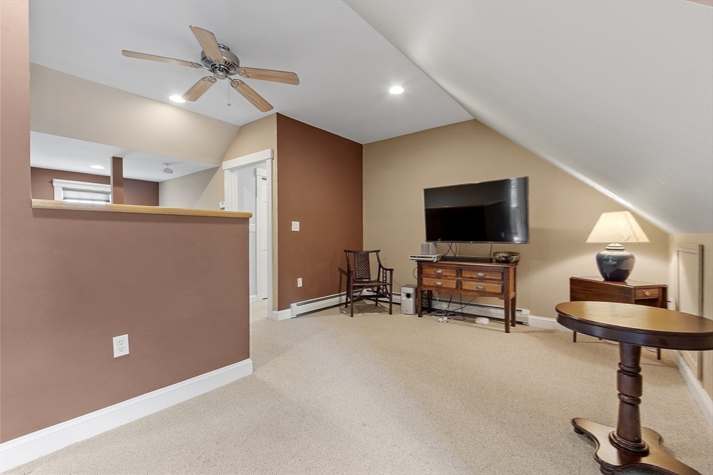 21 High Street Ayer, MA 01432 - Photo 20 of 40 a living room with furniture and a flat screen tv