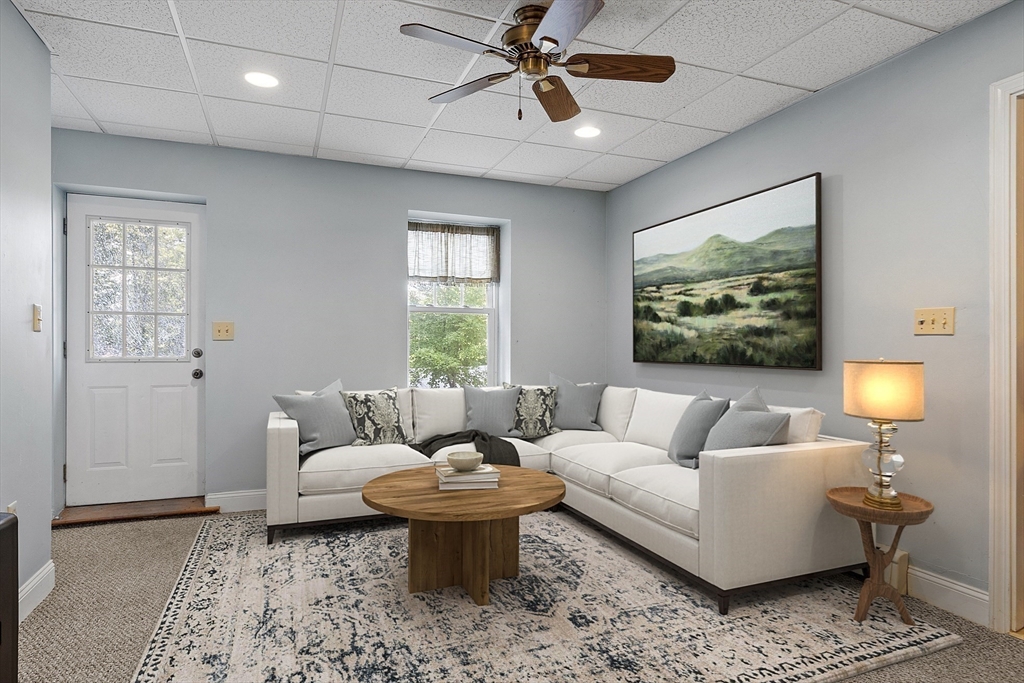 21 High Street Ayer, MA 01432 - Photo 26 of 41 a living room with furniture and a large window