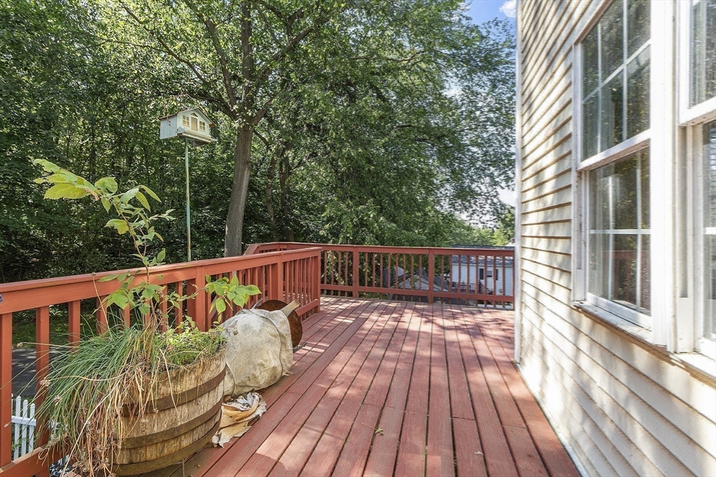 21 High Street Ayer, MA 01432 - Photo 29 of 40 a view of balcony with wooden floor and fence