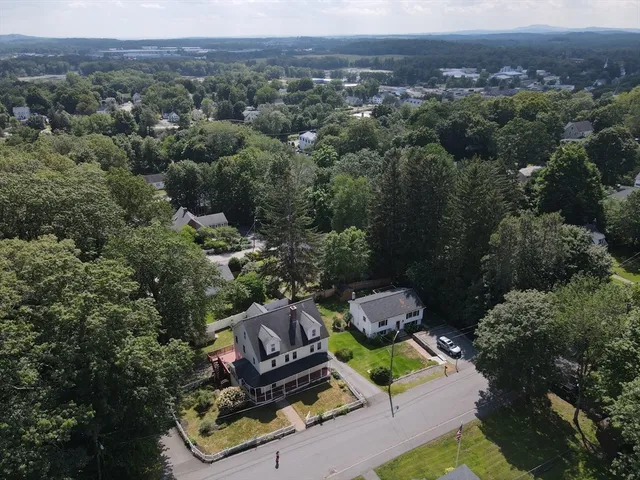 an aerial view of a house with mountain view