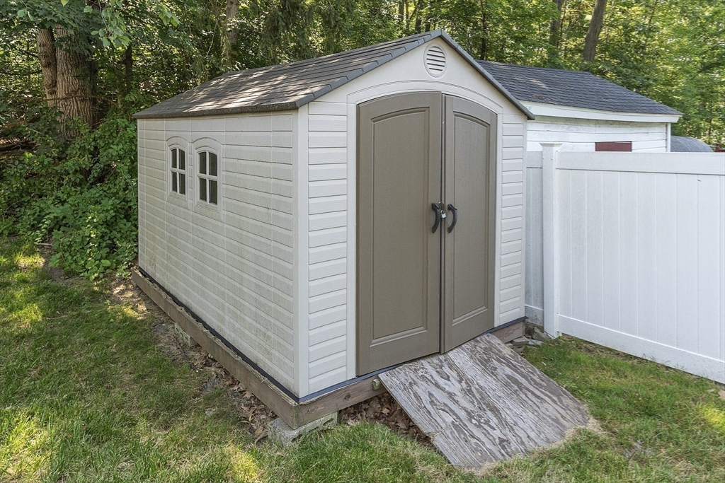 21 High Street Ayer, MA 01432 - Photo 32 of 41 a front view of a house with a yard