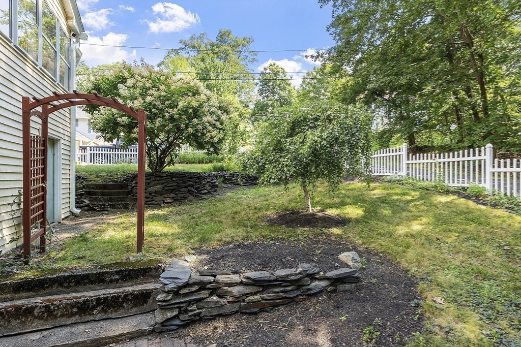 21 High Street Ayer, MA 01432 - Photo 33 of 41 a backyard of a house with lots of green space