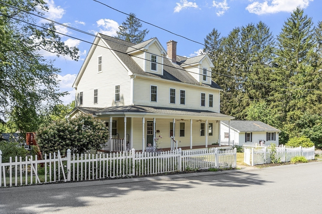 21 High Street Ayer, MA 01432 - Photo 38 of 41 a front view of a house with a garden