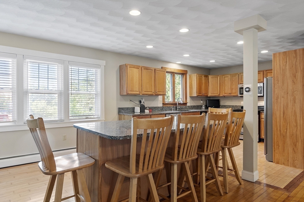21 High Street Ayer, MA 01432 - Photo 4 of 41 a view of a dining room with furniture and a window