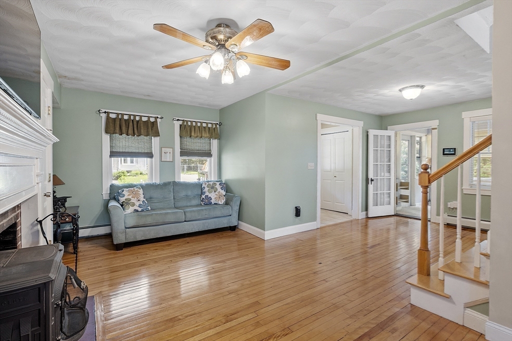 21 High Street Ayer, MA 01432 - Photo 10 of 40 a living room with furniture and a wooden floor