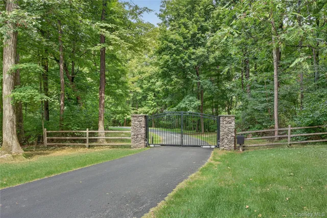 a view of outdoor space with deck and a big yard