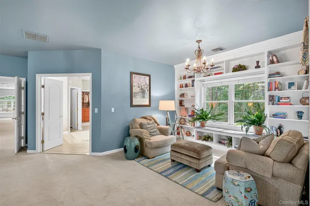 a bedroom with a large bed and a large window