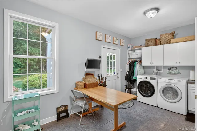 a bathroom with a sink vanity mirror and toilet