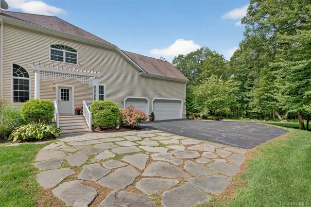 a front view of a building with garden
