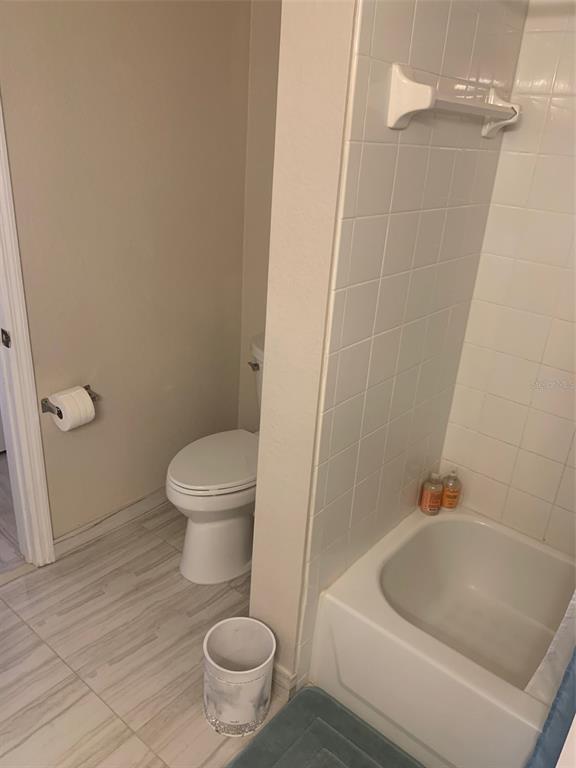 5140 Northridge Road, Unit 204 Sarasota, FL 34238 - Photo 5 of 12 a bathroom with a toilet and a shower