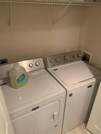 a utility room with dryer and washer