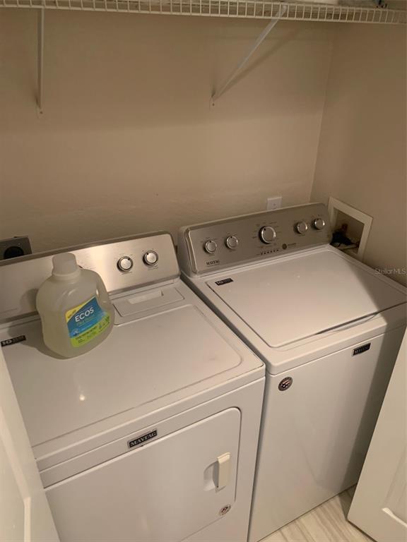 5140 Northridge Road, Unit 204 Sarasota, FL 34238 - Photo 8 of 12 a utility room with dryer and washer