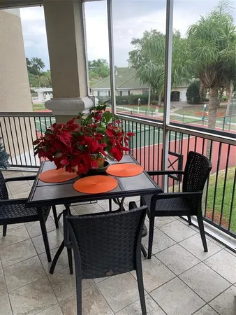 a outdoor dining space with furniture and garden view