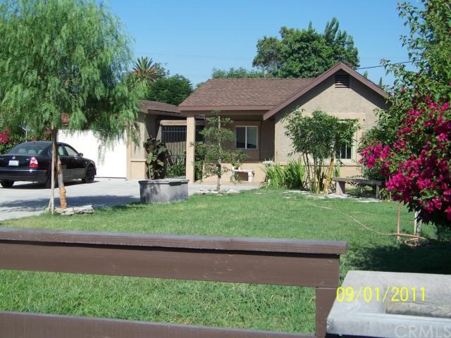 4007 Mennes Avenue Riverside, CA 92509 - Photo 1 of 1 a front view of a house with a yard