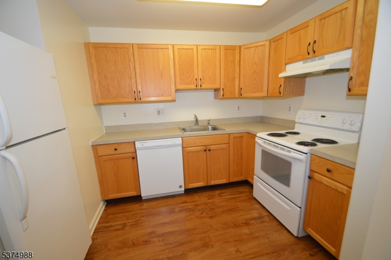 1 Jenny Lind Street, Unit 16 Netcong, NJ 07857 - Photo 12 of 20 a kitchen with a sink stove and cabinets