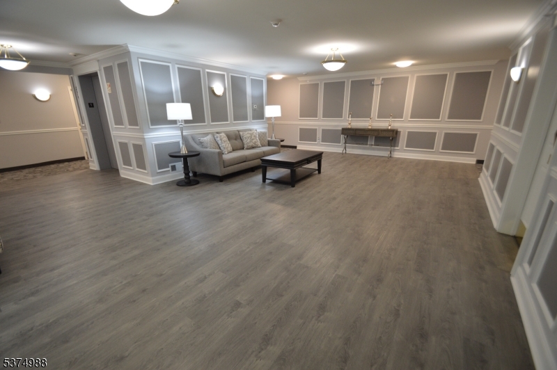 1 Jenny Lind Street, Unit 16 Netcong, NJ 07857 - Photo 2 of 20 a living room with furniture and a wooden floor