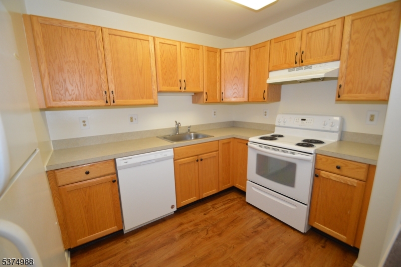 1 Jenny Lind Street, Unit 16 Netcong, NJ 07857 - Photo 10 of 20 a kitchen with a sink stove and cabinets