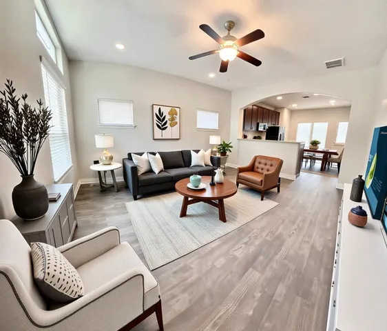 a living room with furniture and a large window