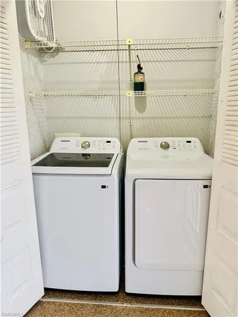 a utility room with dryer and washer