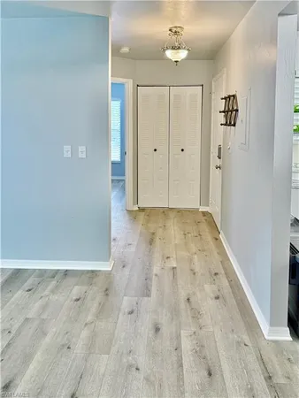 a view of room with wooden floor and staircase