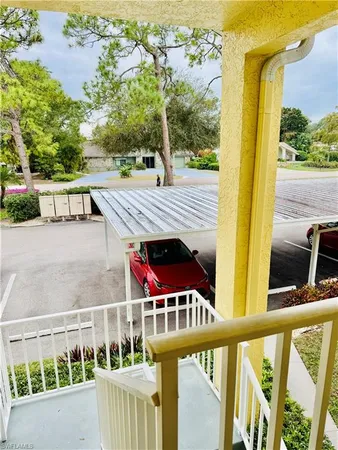 a view of a balcony with small yard