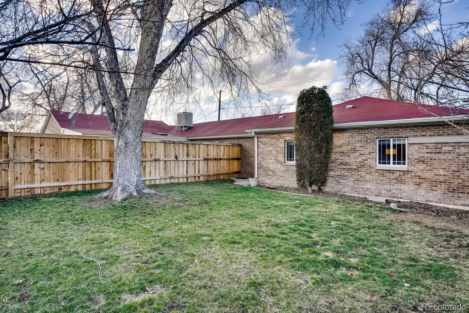 1718 South Decatur Street Denver, CO 80219 - Photo 23 of 28 a front view of a house with a garden