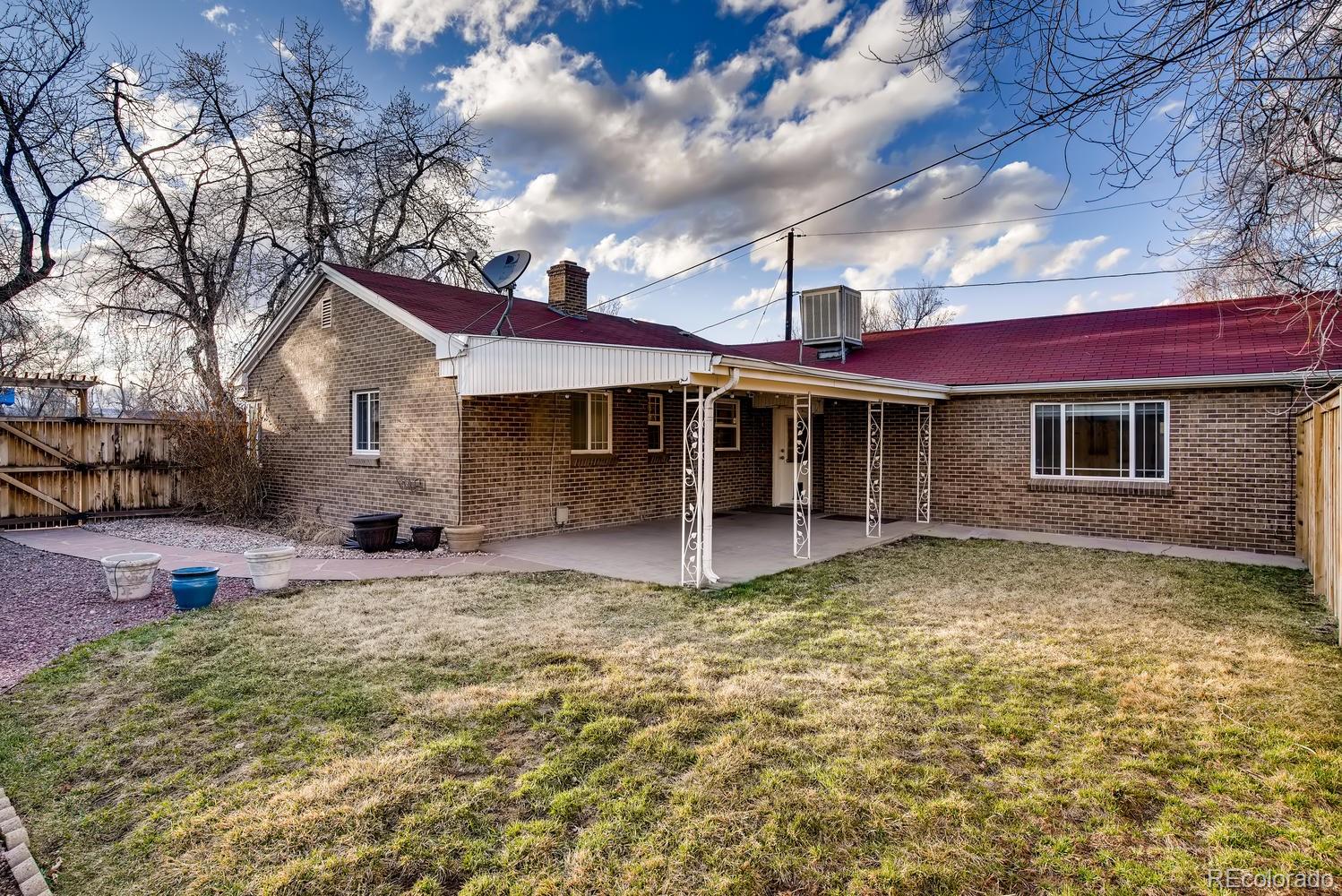 1718 South Decatur Street Denver, CO 80219 - Photo 26 of 28 a front view of a house with a yard