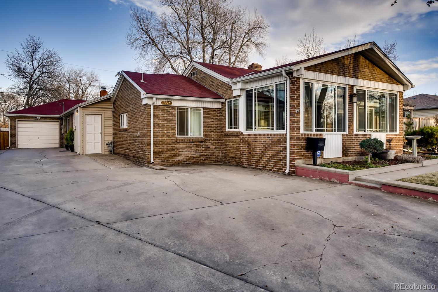 1718 South Decatur Street Denver, CO 80219 - Photo 3 of 28 front view of a house with a street