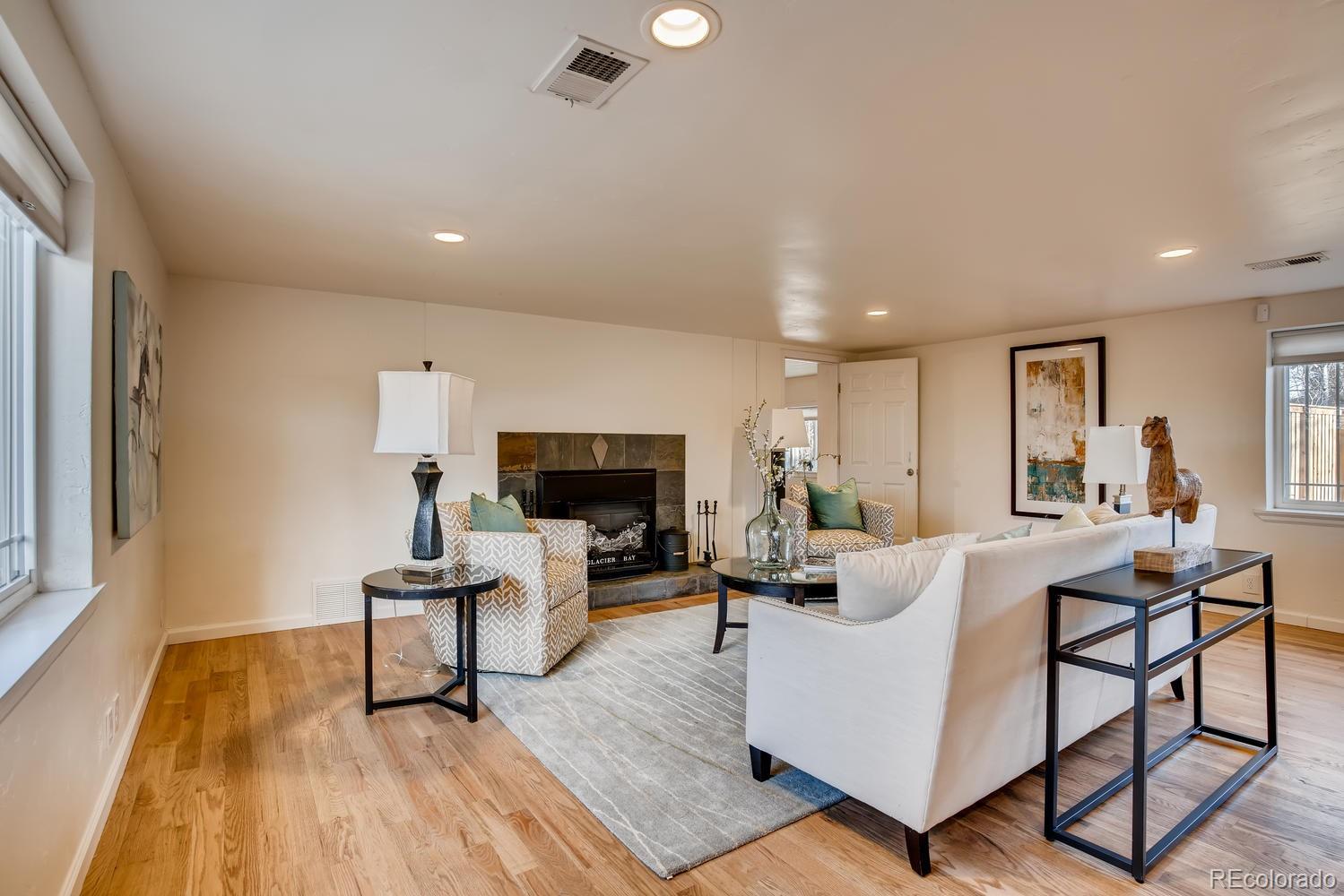 1718 South Decatur Street Denver, CO 80219 - Photo 6 of 28 a living room with furniture and a wooden floor