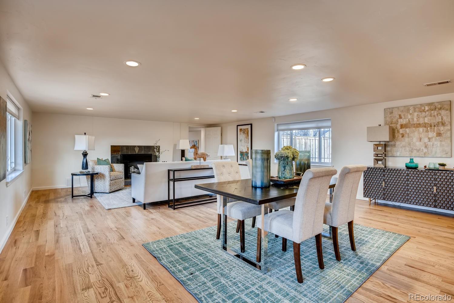1718 South Decatur Street Denver, CO 80219 - Photo 7 of 28 a view of a dining room with furniture and wooden floor