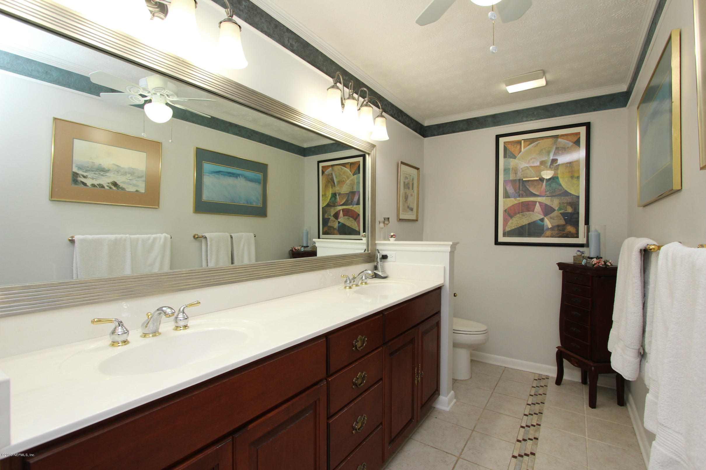 2015 Cornell Road Middleburg, FL 32068 - Photo 16 of 42 a bathroom with a double vanity sink mirror and