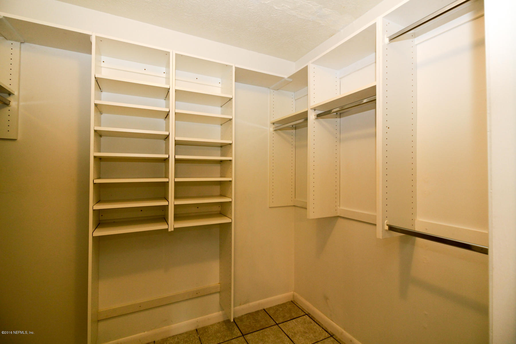 2015 Cornell Road Middleburg, FL 32068 - Photo 19 of 42 a view of walk in closet with empty racks