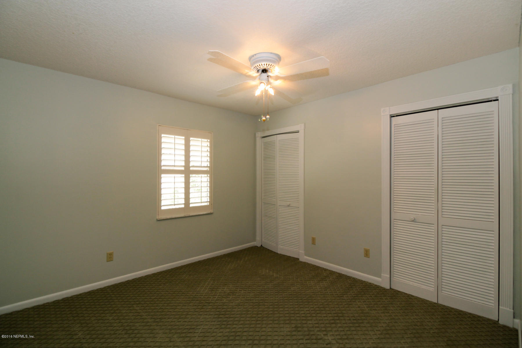 2015 Cornell Road Middleburg, FL 32068 - Photo 23 of 42 wooden floor in an empty room with a window