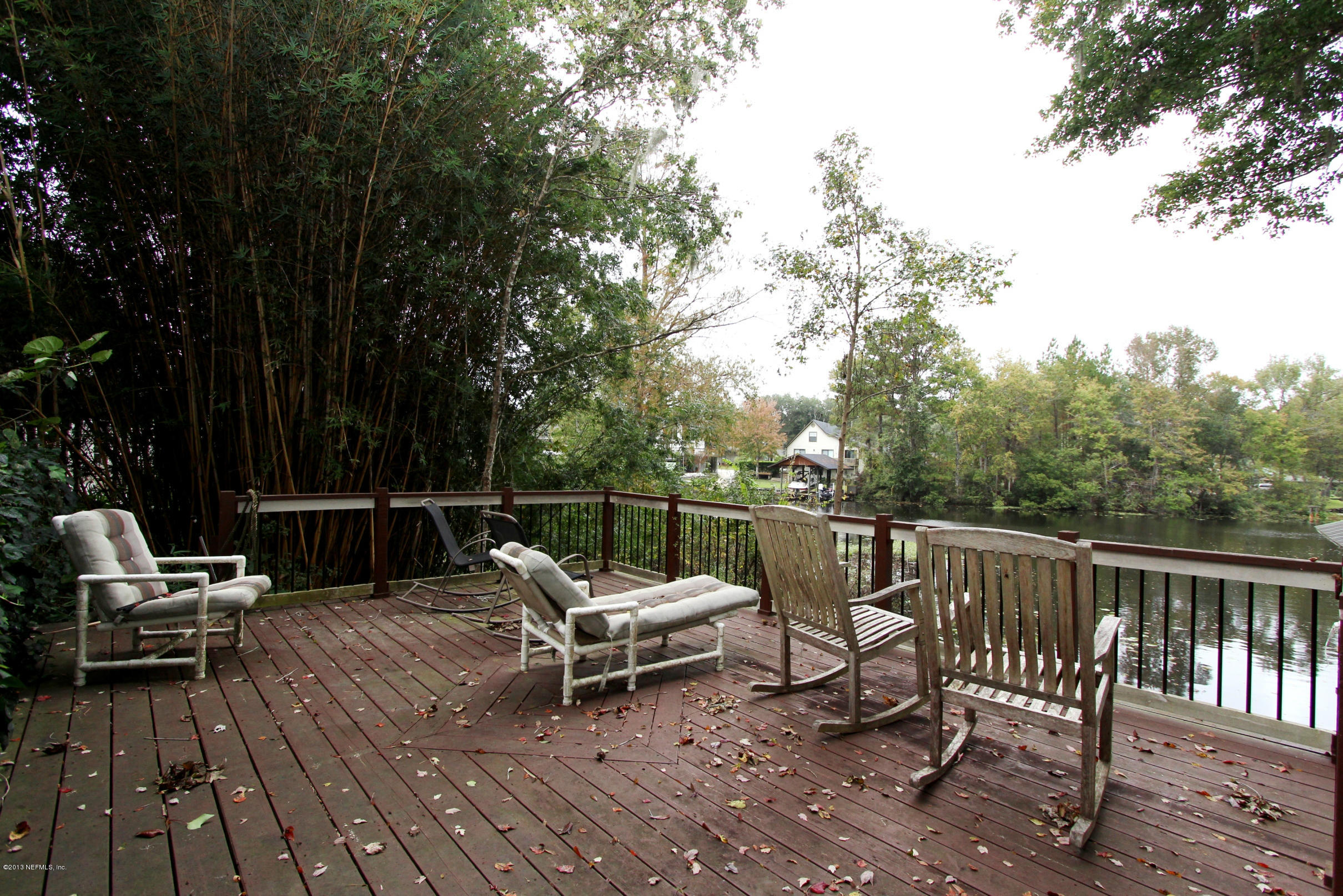 2015 Cornell Road Middleburg, FL 32068 - Photo 31 of 42 a view of a chairs and table on the deck