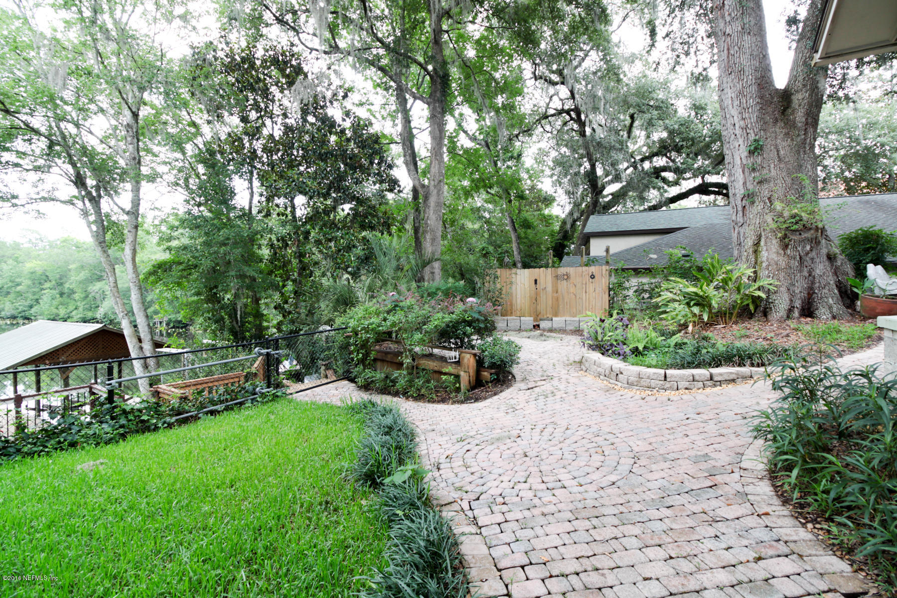 2015 Cornell Road Middleburg, FL 32068 - Photo 37 of 42 a view of a garden with plants and large trees