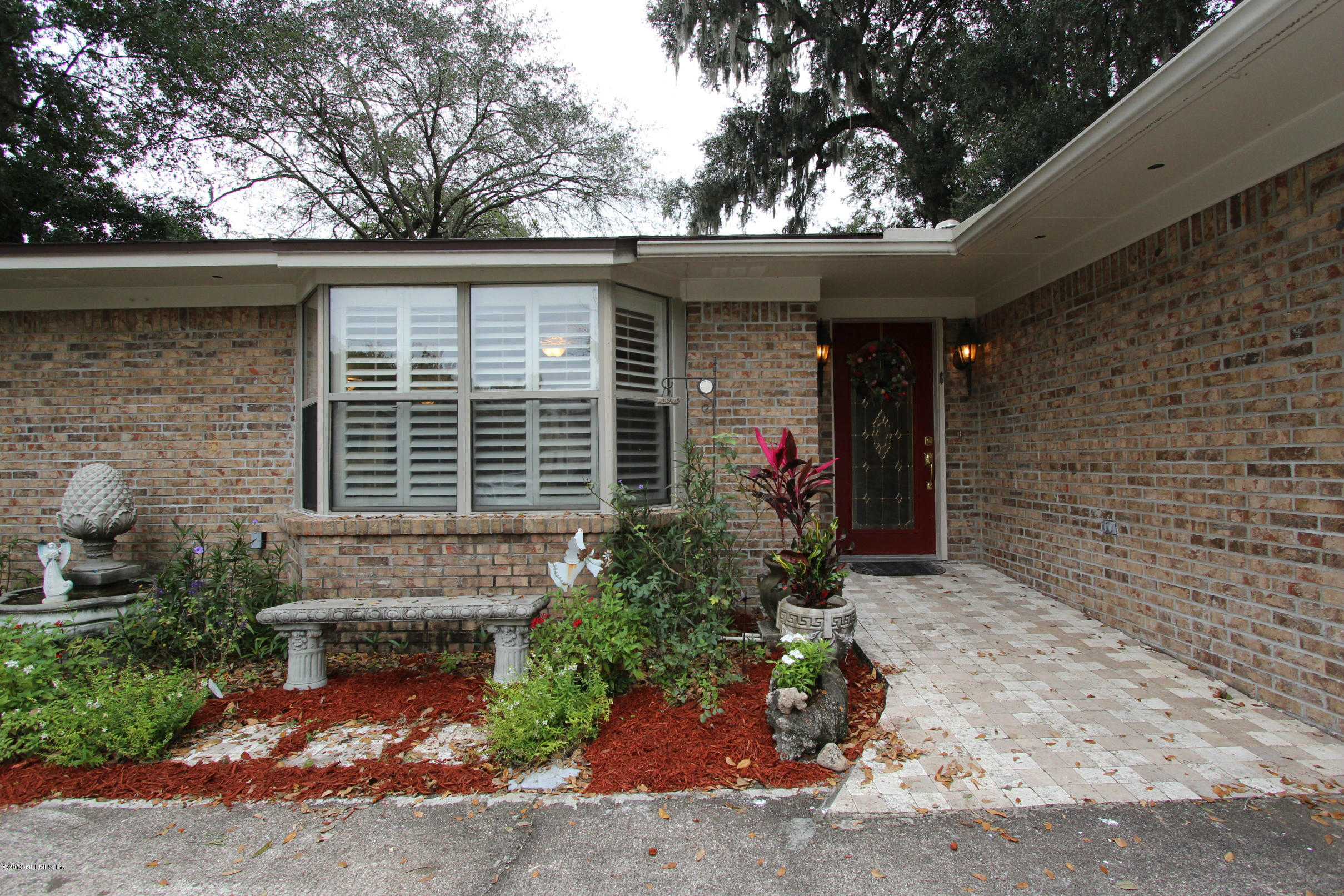 2015 Cornell Road Middleburg, FL 32068 - Photo 42 of 42 a front view of a house with a garden